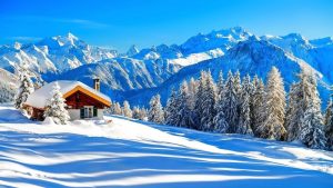 Beautiful snow mountain background with a house