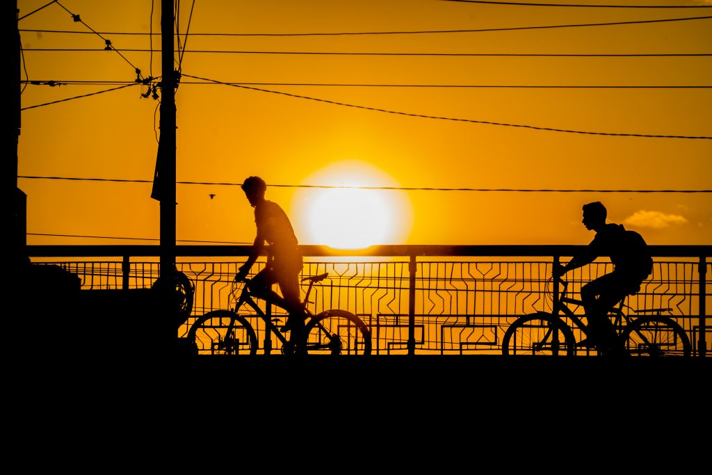 Cycles at sunset by radu galan