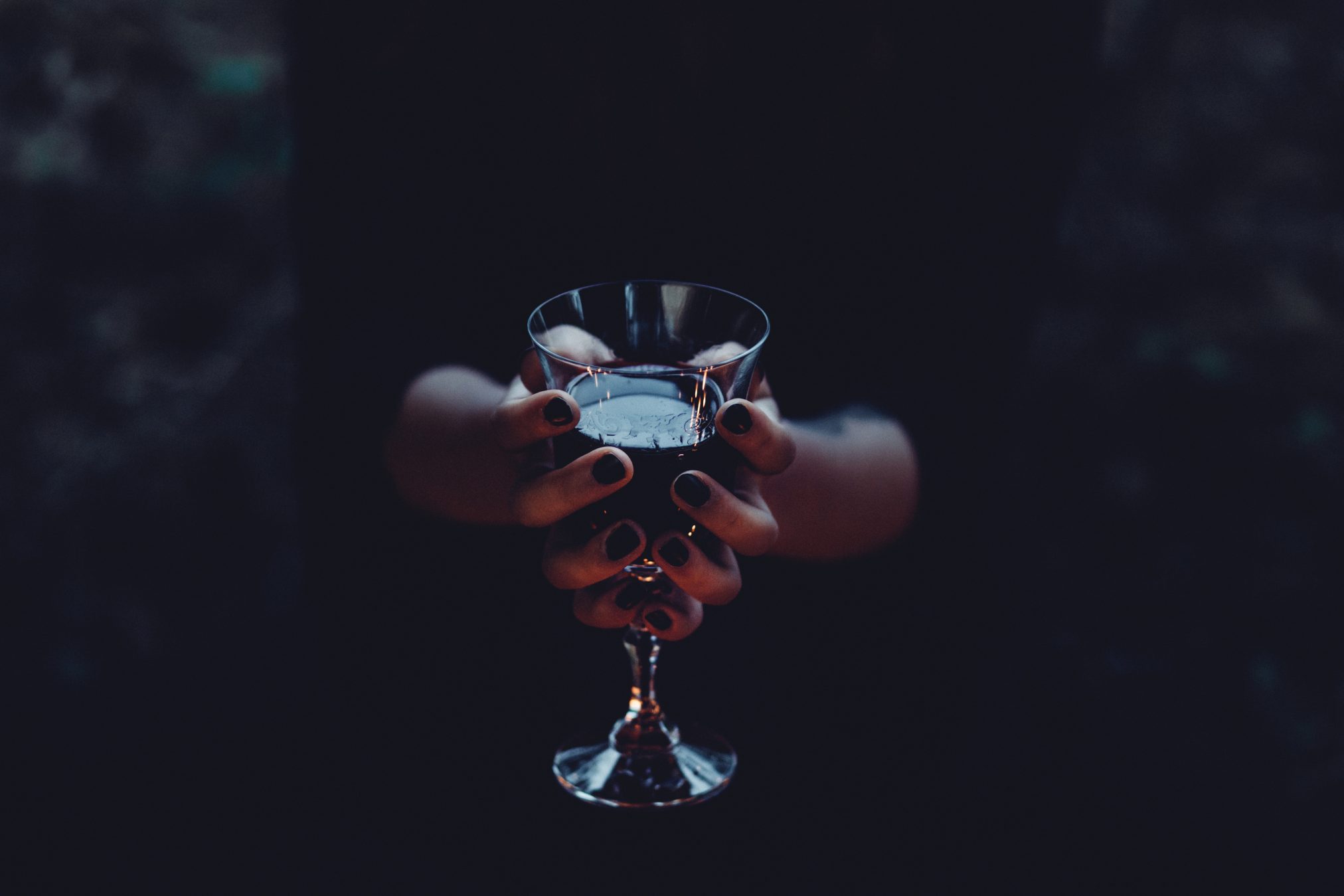 Witch holding a glass of wine by joanna foto - Ubuntu Budgie 26.04 Wallpapers - Official Indigo Collection