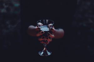 Witch holding a glass of wine by joanna foto - Ubuntu Budgie 26.04 Wallpapers - Official Indigo Collection