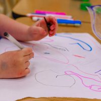 Edubuntu 26.04 erika fletcher a child is drawing on a piece of paper