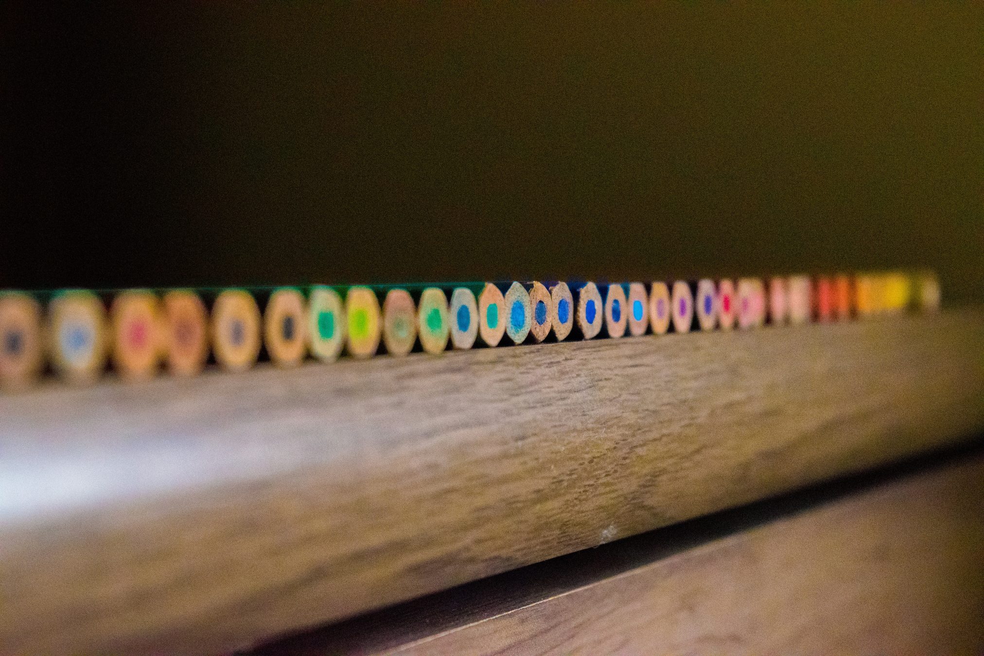 Edubuntu 26.04 lavira closeup photo of color pencil on brown surface - Edubuntu 26.04 Wallpapers - Official Education-Themed Collection