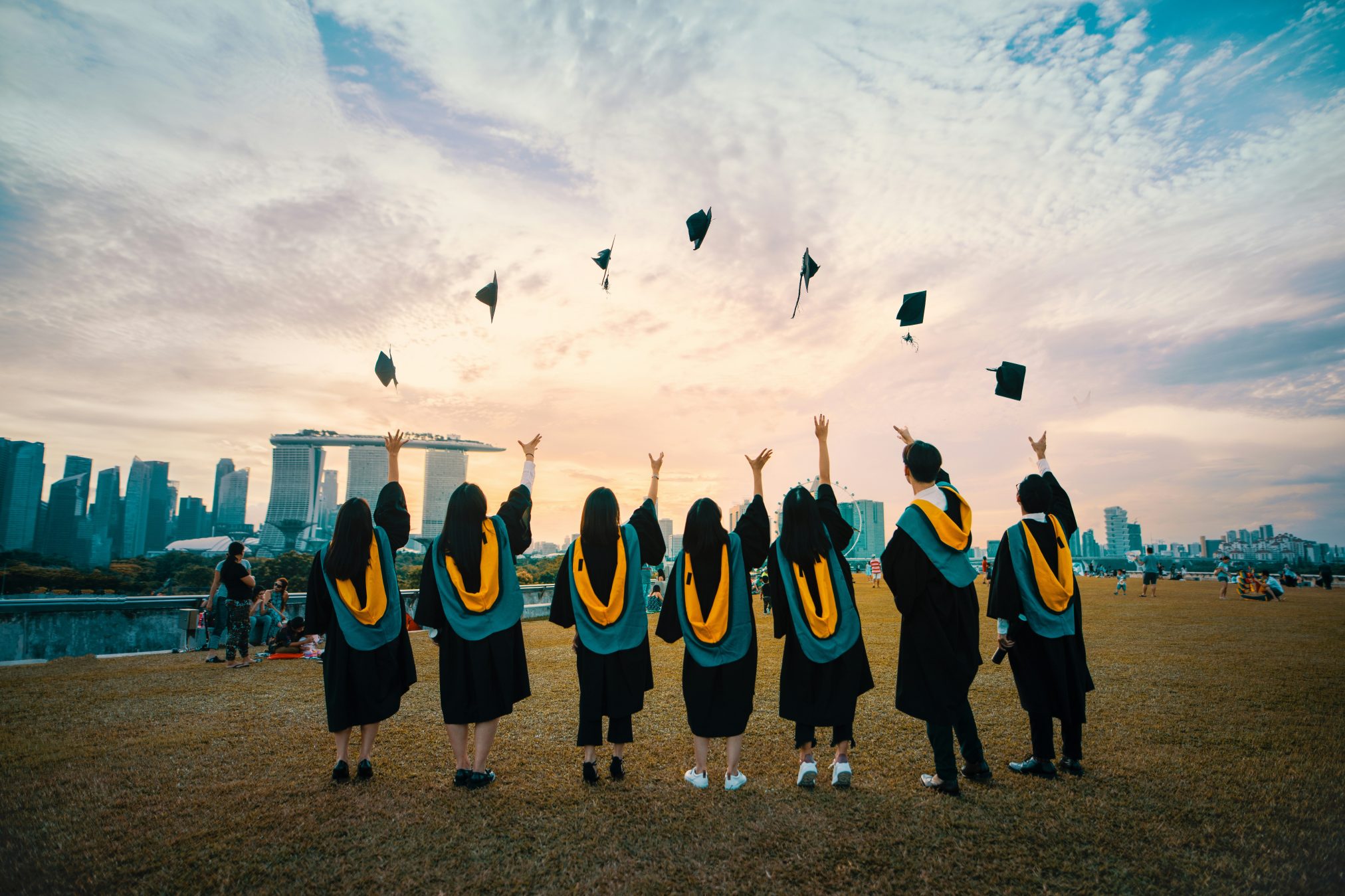 Edubuntu 26.04 pang yuhao people throwing hats on air - Edubuntu 26.04 Wallpapers - Official Education-Themed Collection